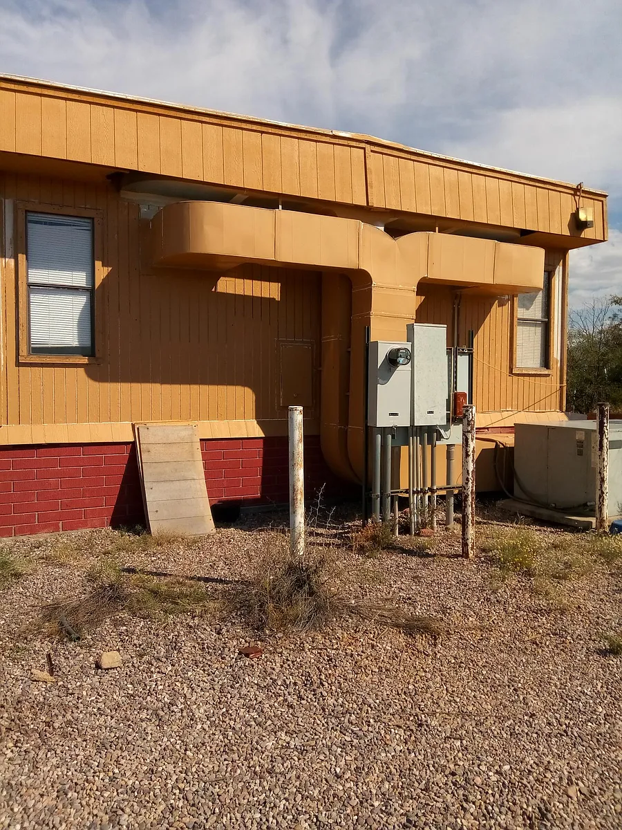 West side of the building and electric panels - 5850 E Comsoft Pl