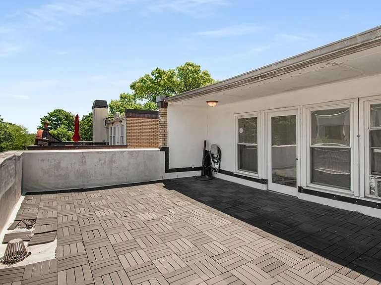 Spacious rooftop patio with views of Midtown and Downtown