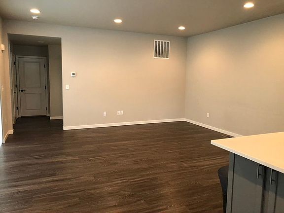 Open floor plan. -this is the living room, located right next to the kitchen island.