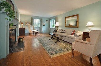 Living room with hardwood floors, French doors to screened Porch.