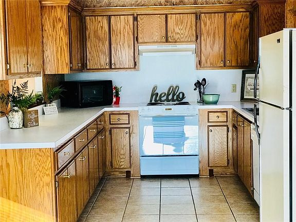 Cabinets galore and slick as a whistle clean.