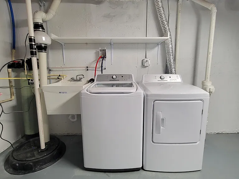 Laundry room, utility sink and shelving.