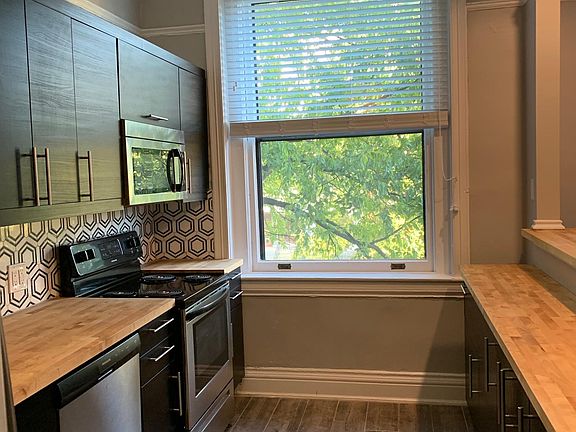 kitchen with bi-level bar open to LR