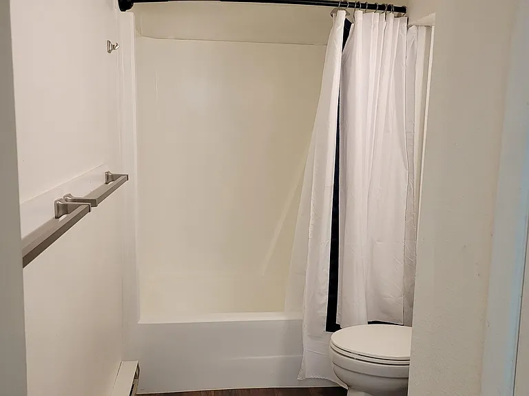 Downstaira bathroom 2 is a newly remodeled full bath with large linen closet.