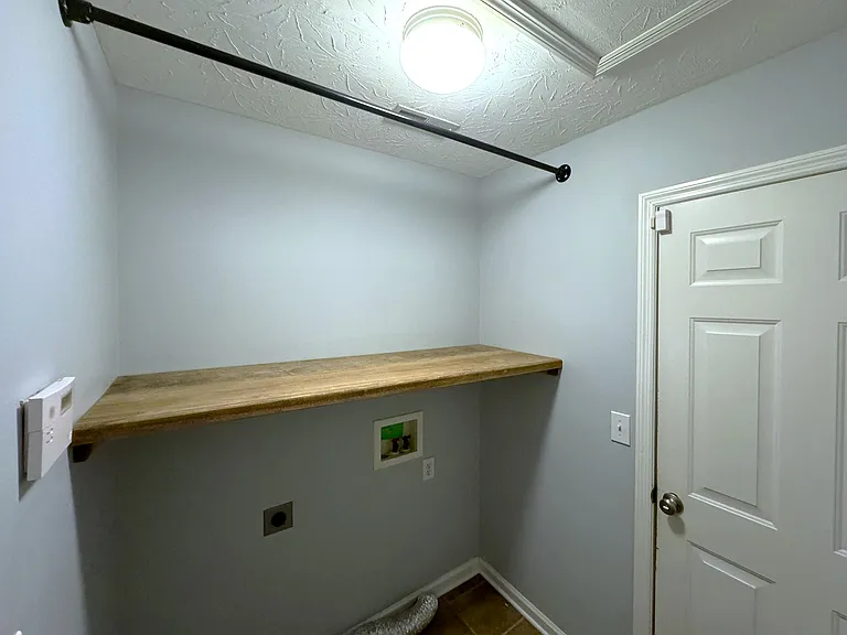 Laundry room - upgraded shelf for storage & hook up
