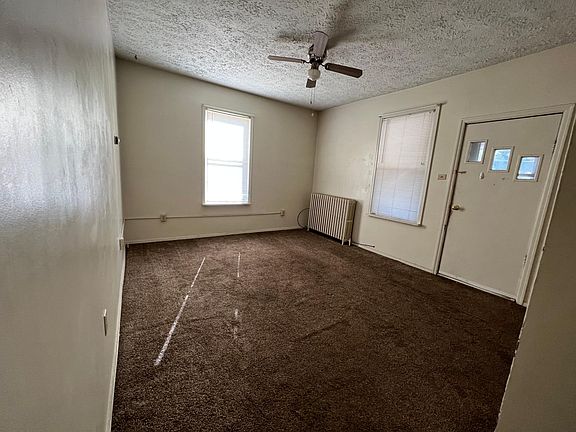 Living room With Access To Rear Entrance Deck Area