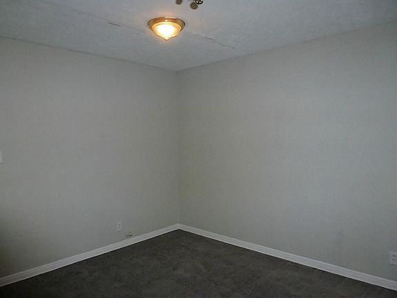 Dinning area with new light fixture and carpet