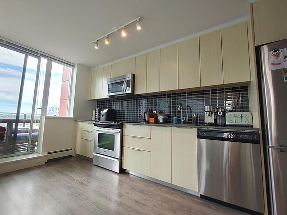 Kitchen. Large and small appliances pictured are included.