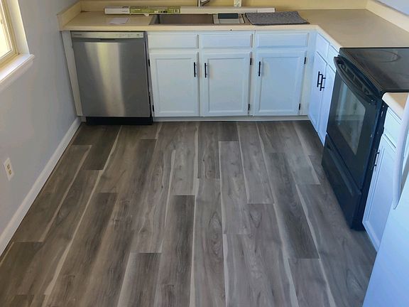 Freshly painted new kitchen cabinets and BRAND NEW SINK and Faucet! Dishwasher Also only 1 years old.
