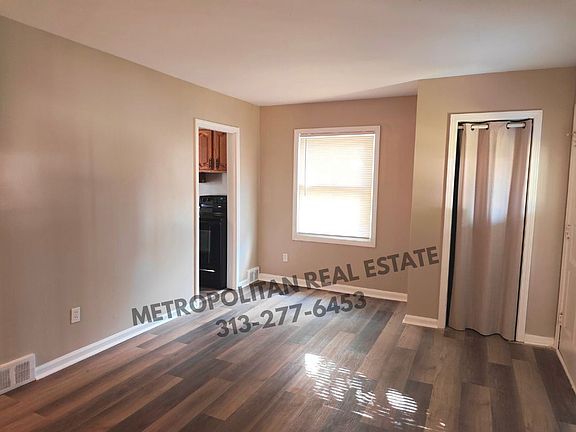 Living room where kitchen doorway is located