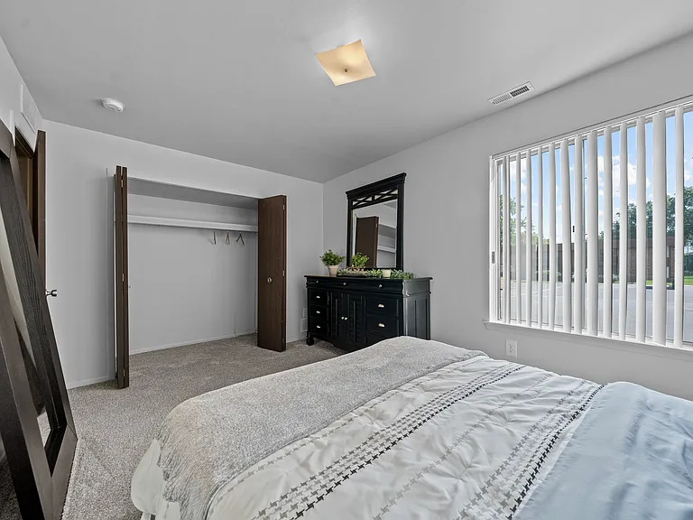 Big bedroom with natural lighting at Westwood Village Apartments in Westland, MI