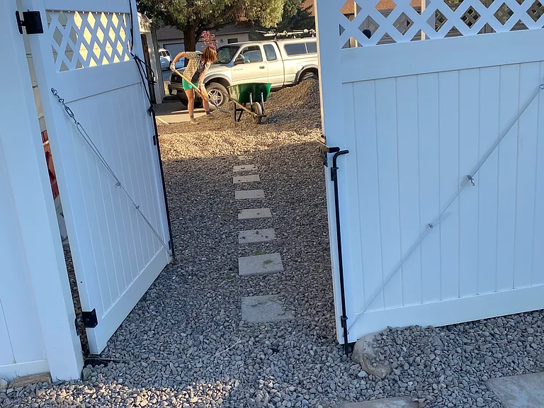 stone path between driveway and backyard