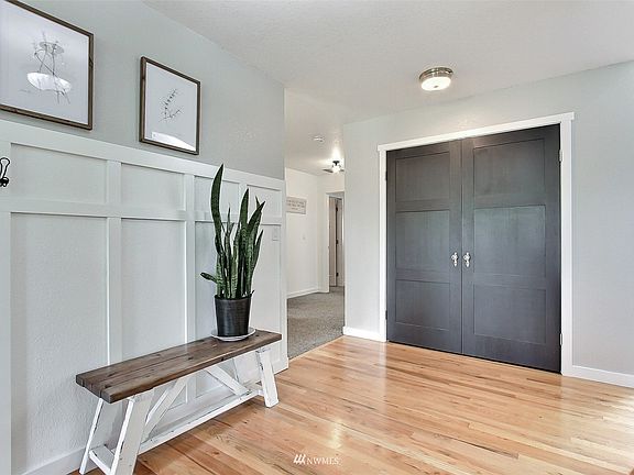 View as you enter the home, you will love the décor throughout! Double coat closet straight ahead, bedrooms to left, living room to right. 