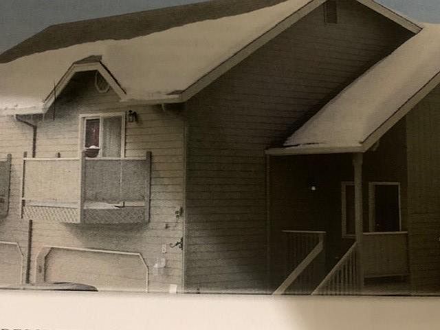 Exterior of one of the units. This one has a ground level walk in but otherwise similar covered porch.