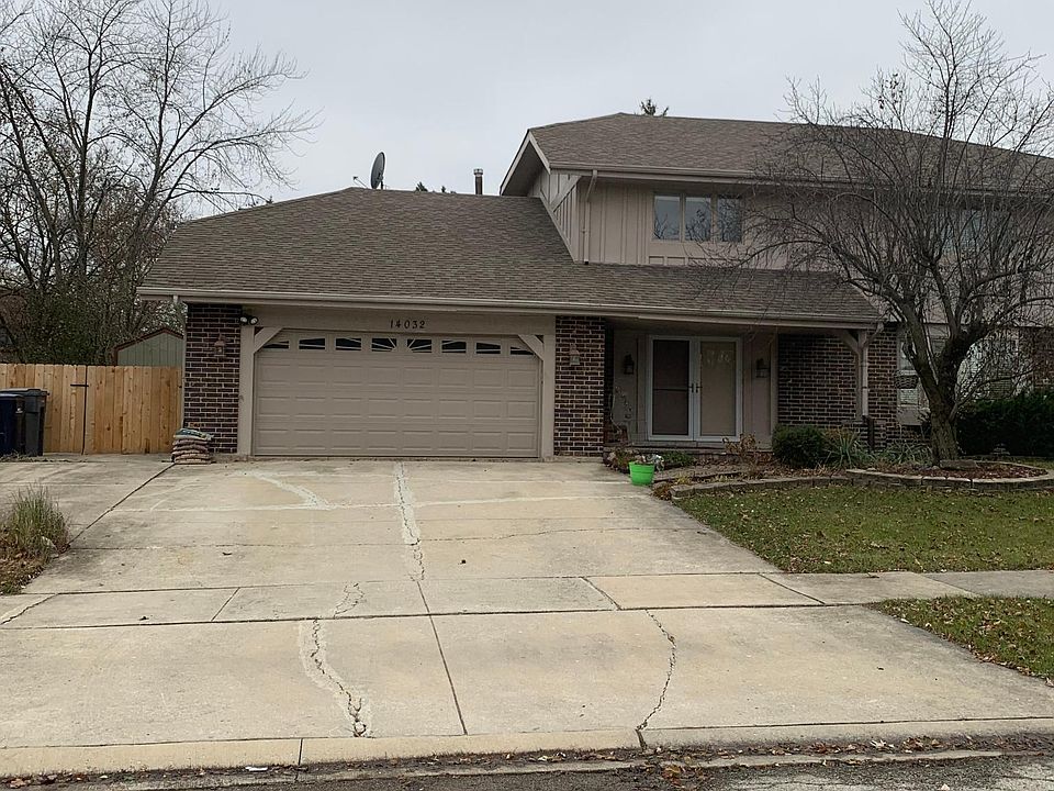 New garage door with remote control for a 2 1/2 car garage. New wooden fence and gate