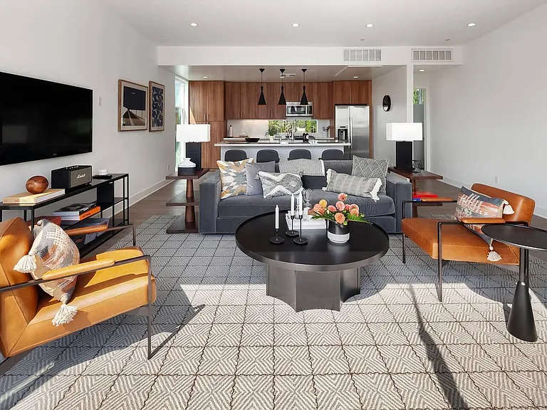 Kitchen (3rd floor) is connected to living room, creating a shared space that is both beautiful and functional.