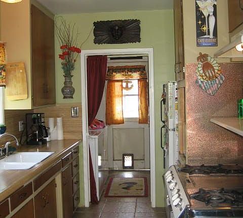 Galley kitchen to laundry room and exit door