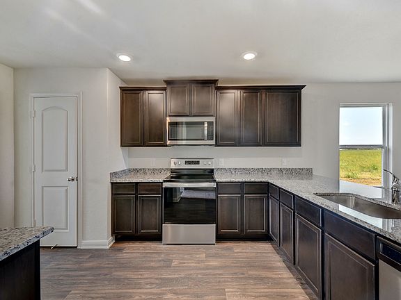 The kitchen comes with a full suite of energy-efficient appliances