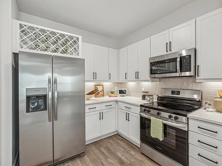 Kitchen with Quartz Countertop and Stainless Steel Appliances.