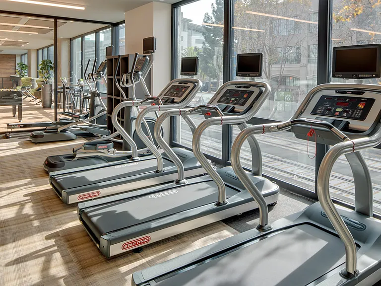 HIIT inspired 24/7 fitness center with TRX bands, weight stations and cardio stations.