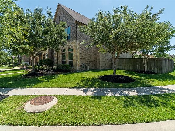 This home sits atop a large corner lot with mature trees and side yard!