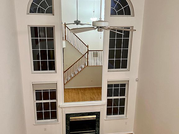 Natural light comes through this family room with gas fireplace.
