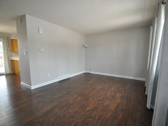 Main-level living room with dining area entrance to the left.