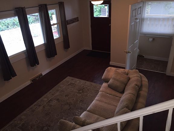 Partial view of family room from stairs and new half bath.