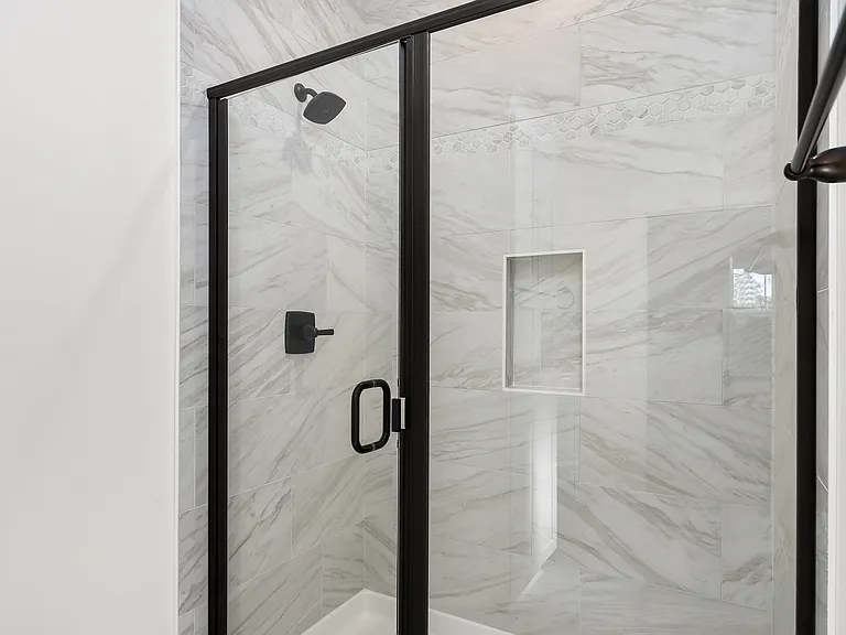 Master bathroom glass shower enclosure.
