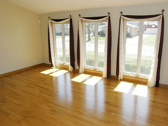 Living Room with Large windows &amp; Hardwood floors
