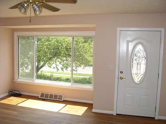 Liv. Rm features a large picture window and a beautiful oval glass door.