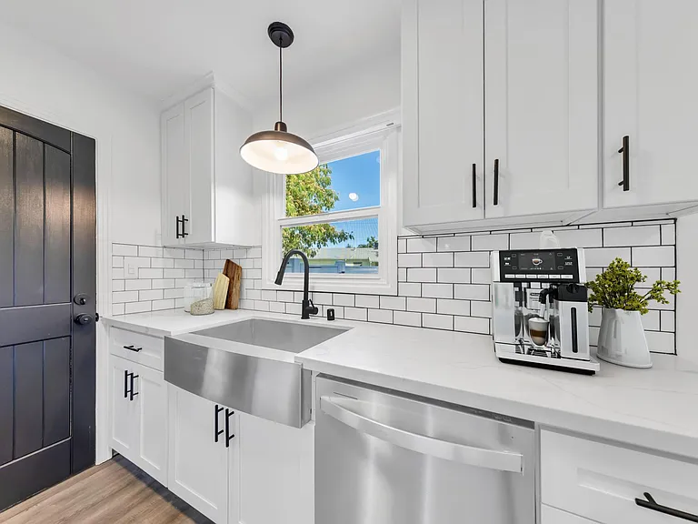 Deep, stainless steel farmhouse sink.