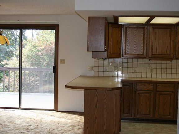 Slider door off kitchen and dining space.
