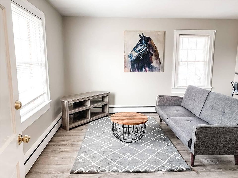 Living Room with Sleeper Sofa and TV (television will be provided before move in).