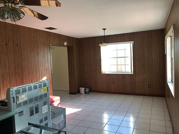 Bright and spacious family room with a door that leads to t