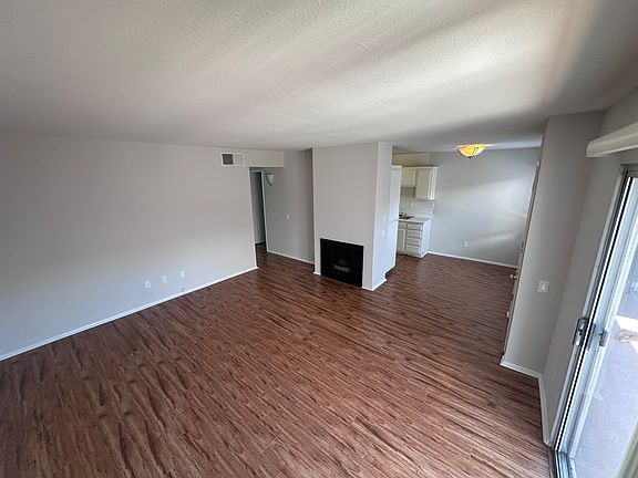 Expanded view from living room showing slider. This is a second floor unit, no private balcony.