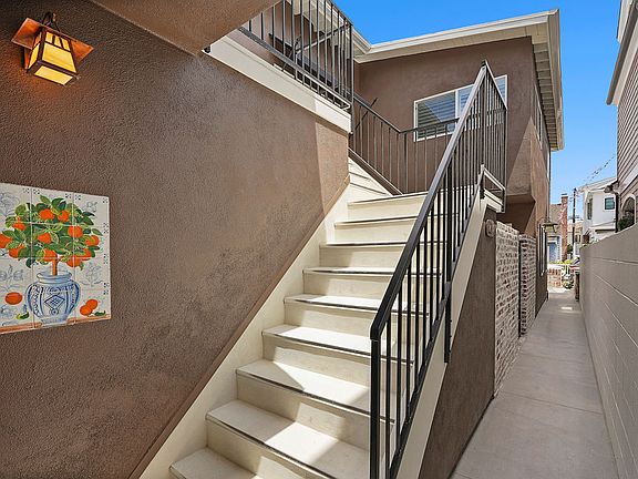 Inviting entry with european wall tile and designer accent lighting