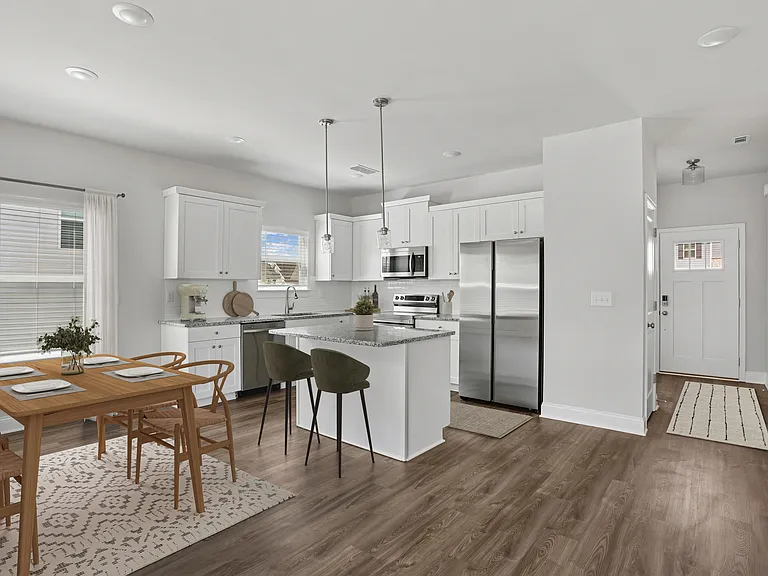 Alternate view of the kitchen and hallway entryway.