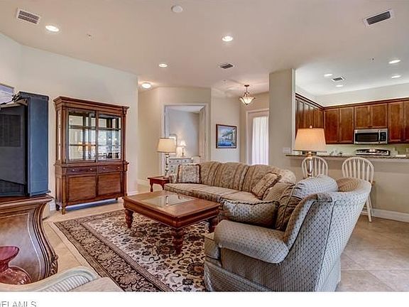 Living Room Looking into Entry & Kitchen