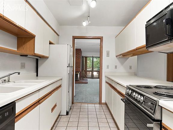 Kitchen offers plenty of cabinet and counter space.