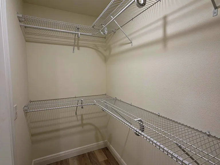 Another view of master walk in closet