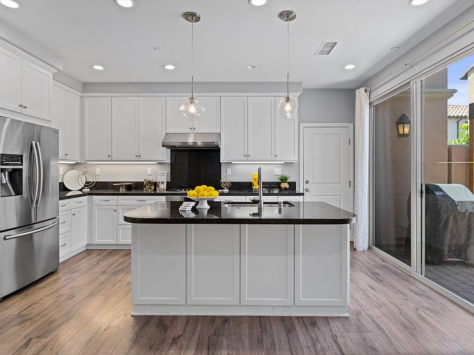 Open concept kitchen/living area that opens to patio