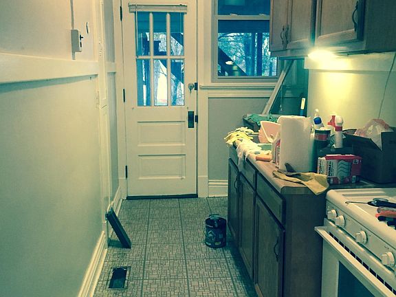 small kitchen owith private screened porch out back