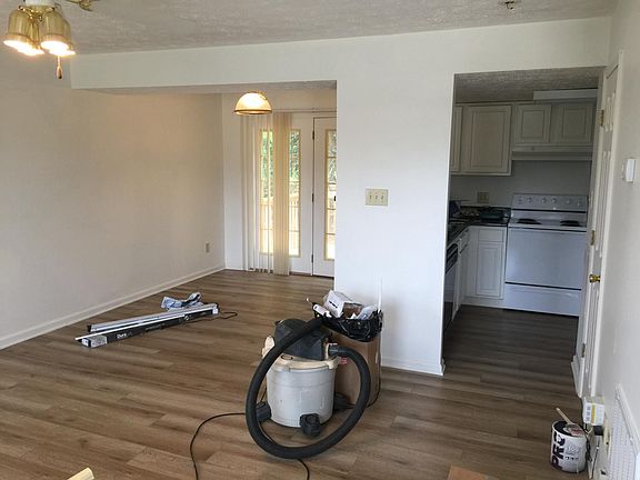 Living Room Dining Room and kitchen all freshly painted with new LVT flooring!