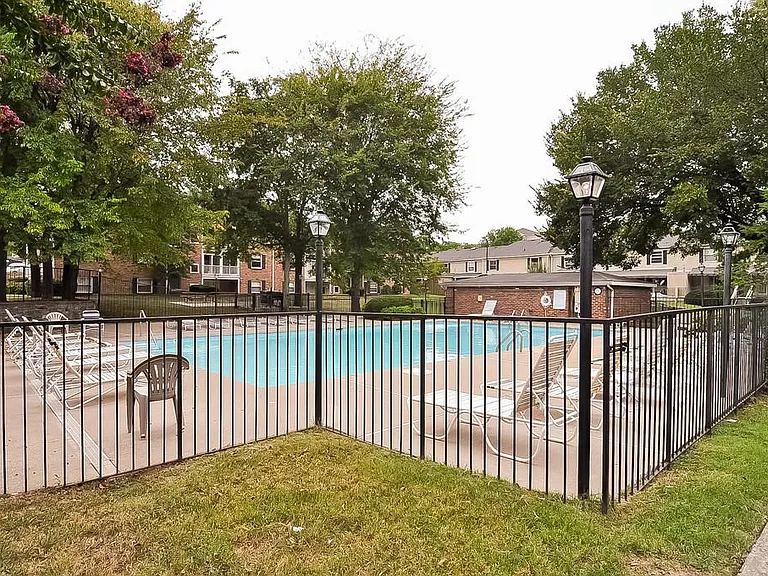 pool with clubhouse at left