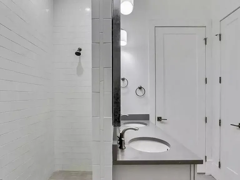 Master bath- shower, vanity linen closet and large walk in closet