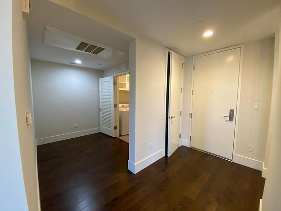 Entrance with Coat Closet, Den space & Laundry Room