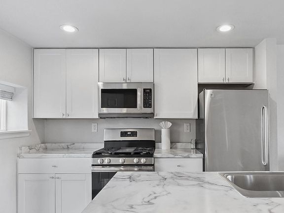 Plenty of cabinets, 5 burner stove.