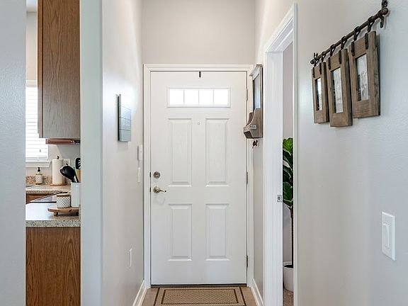 Front Entrance hallway. Kitchen on left, master on right.