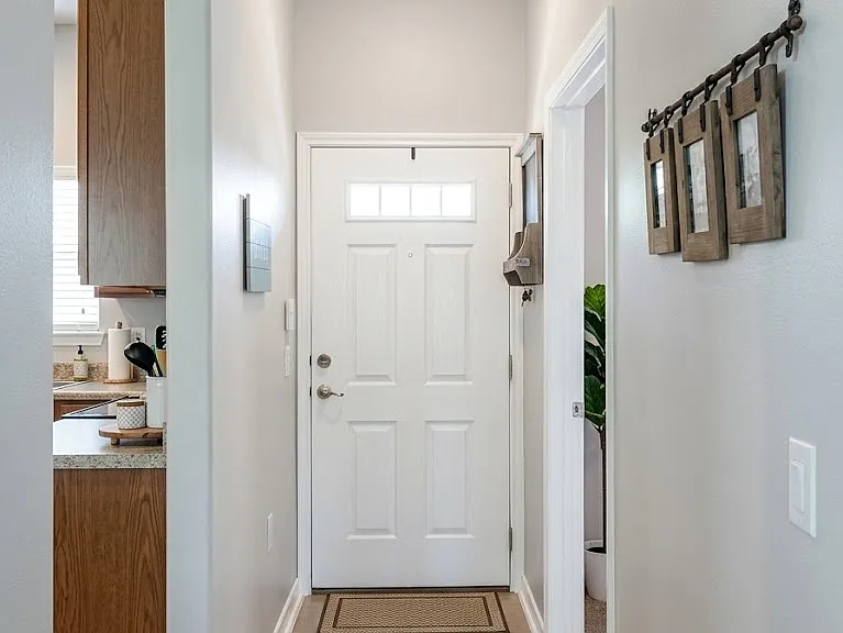 Front Entrance hallway. Kitchen on left, master on right.